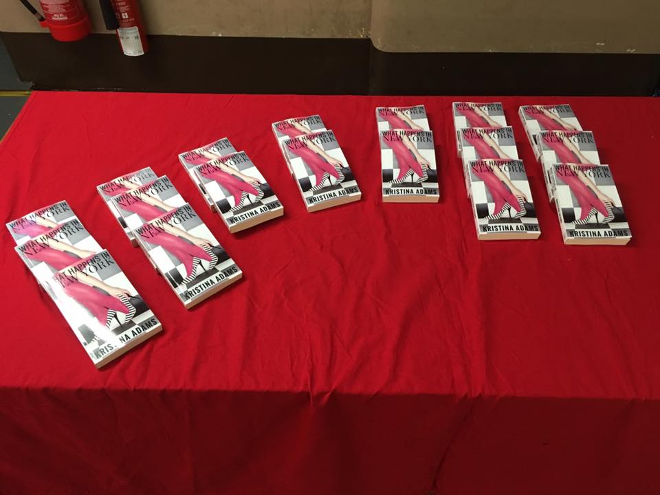 Books lined up at the launch for What Happens in New York!